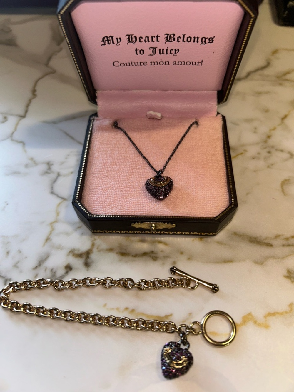 Juicy Couture purple crystal heart charm necklace and bracelet set.